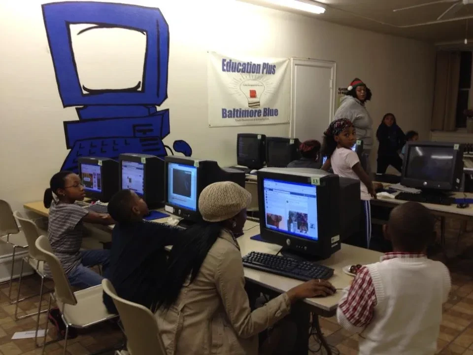 Students using computers in the Education Plus Baltimore Blue computer lab