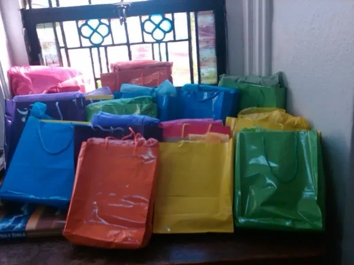 Colorful gift bags prepared for community youth